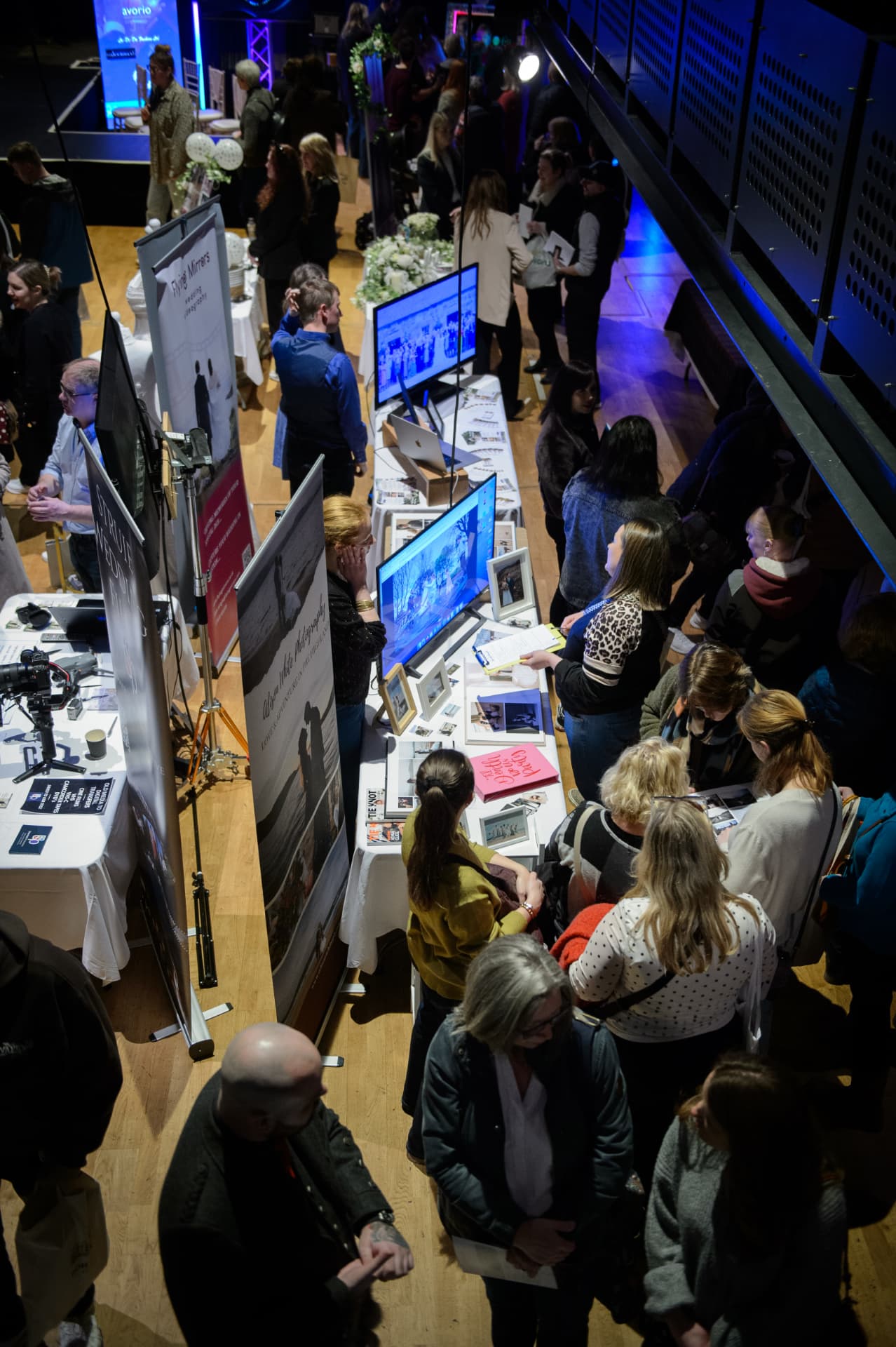 Exhibitor stands and floral displays filling the fair hall