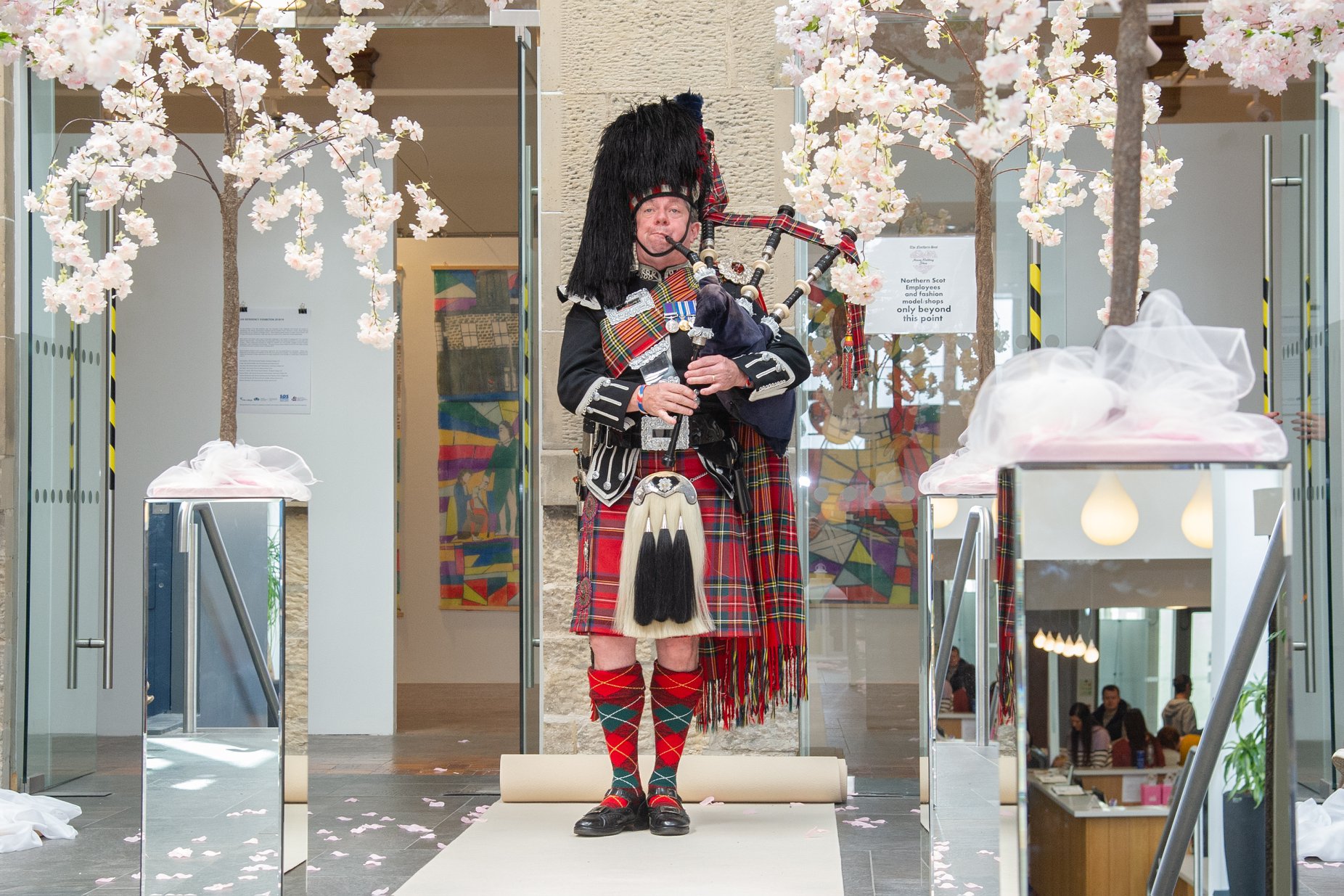 Piper in full Highland dress performing at the Moray Wedding Show